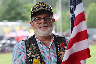 Photo of veteran with flag